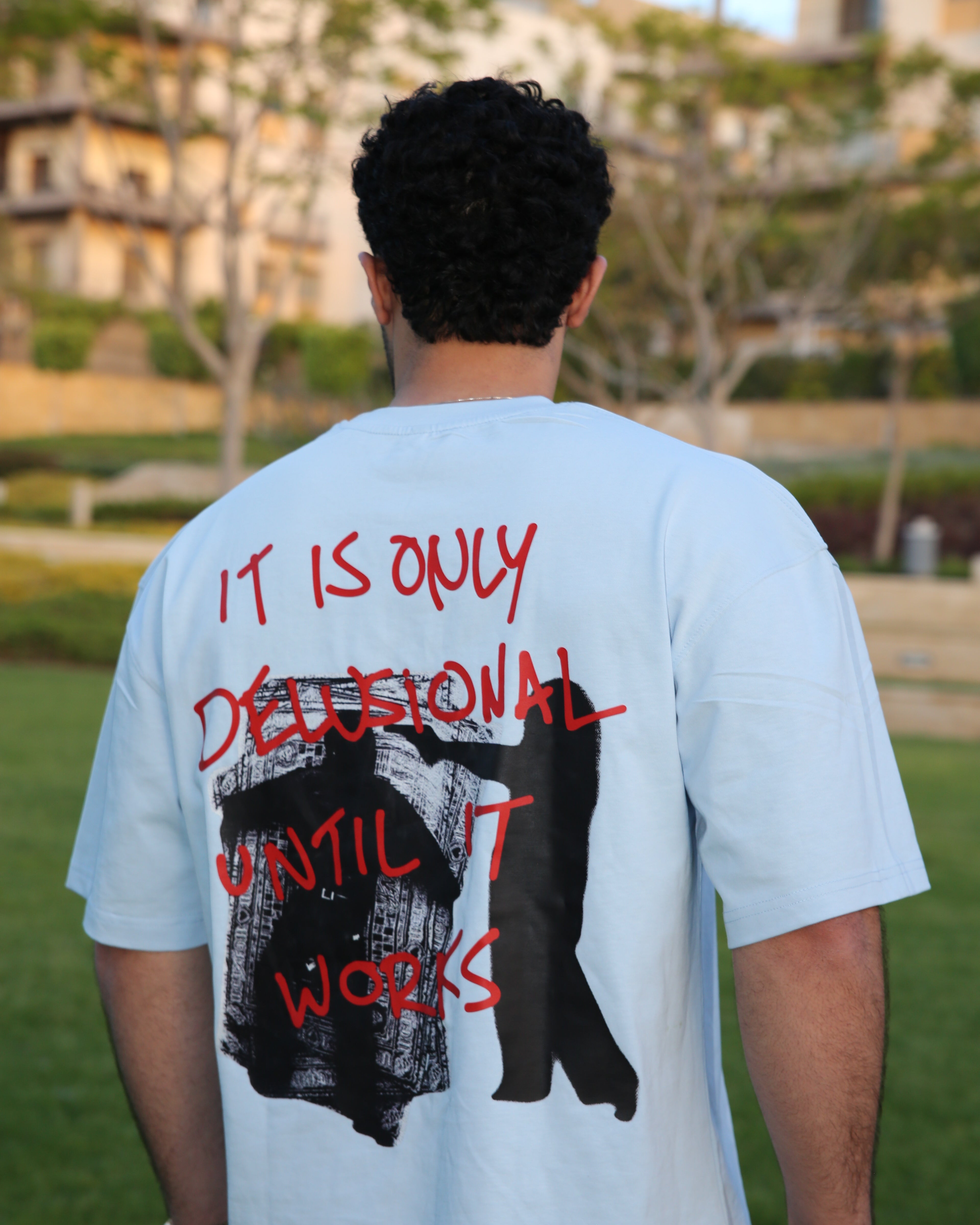 Baby blue "BEYOND DELUSION" box fit T-shirt