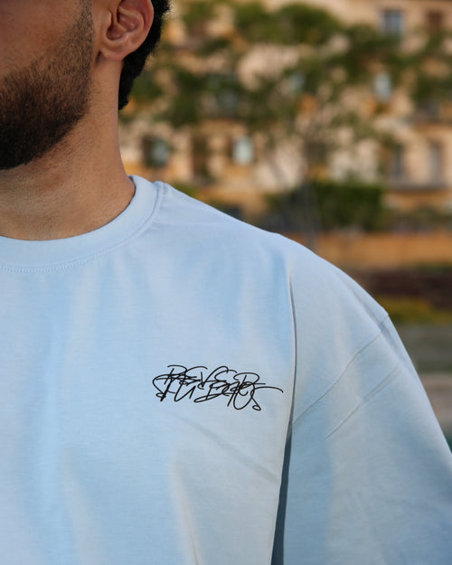 Baby blue "BEYOND DELUSION" box fit T-shirt