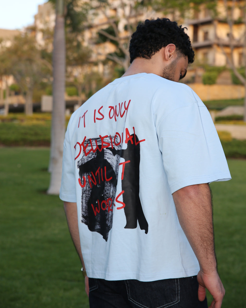 Baby blue "BEYOND DELUSION" box fit T-shirt